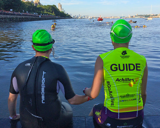 Tiff holding hands with Sarah Heller before the NYC Tri swim start